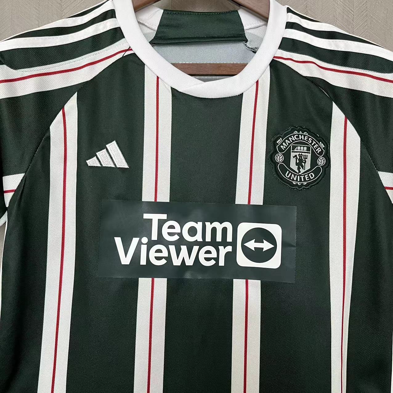 KIT INFANTIL MANCHESTER UNITED AWAY 23/24