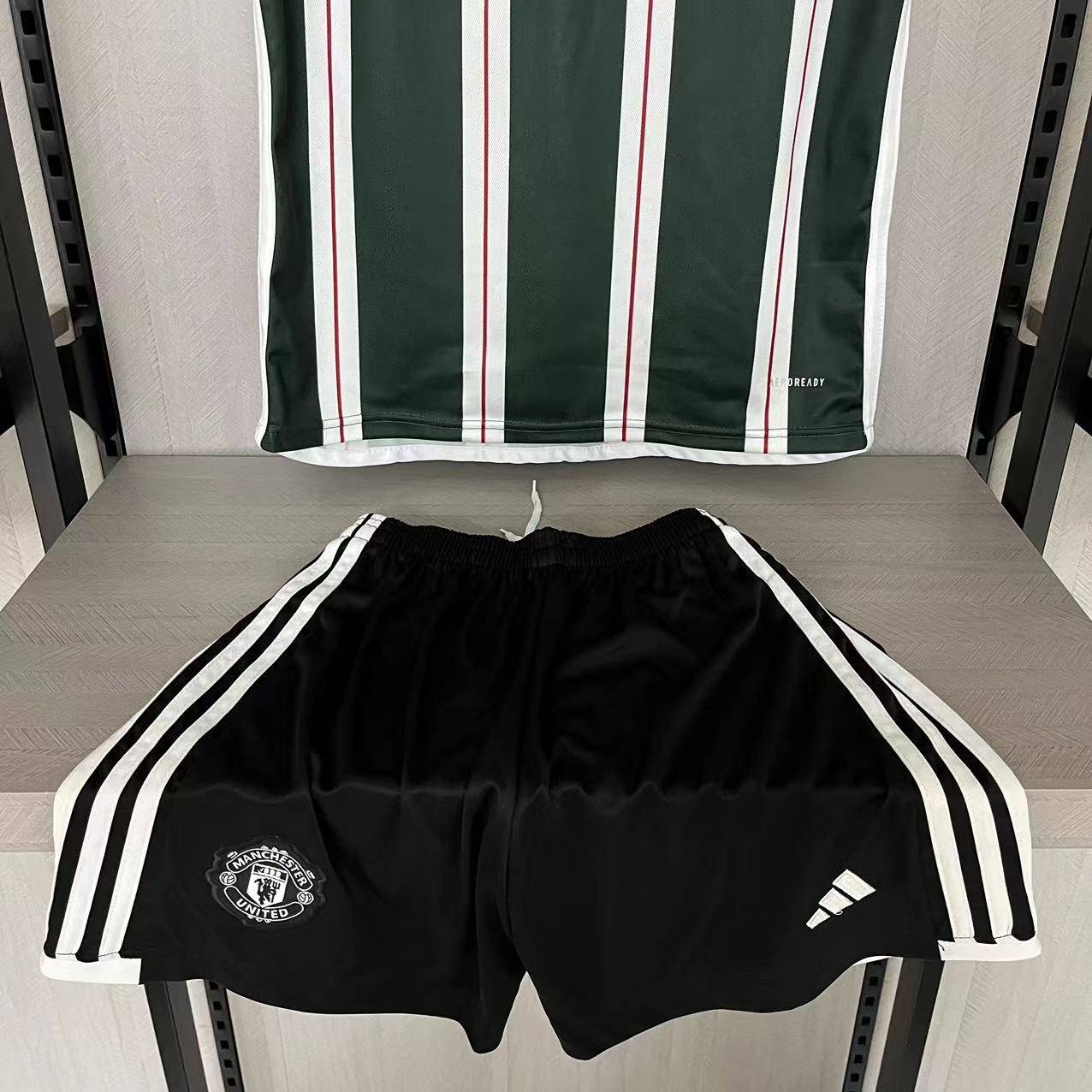KIT INFANTIL MANCHESTER UNITED AWAY 23/24