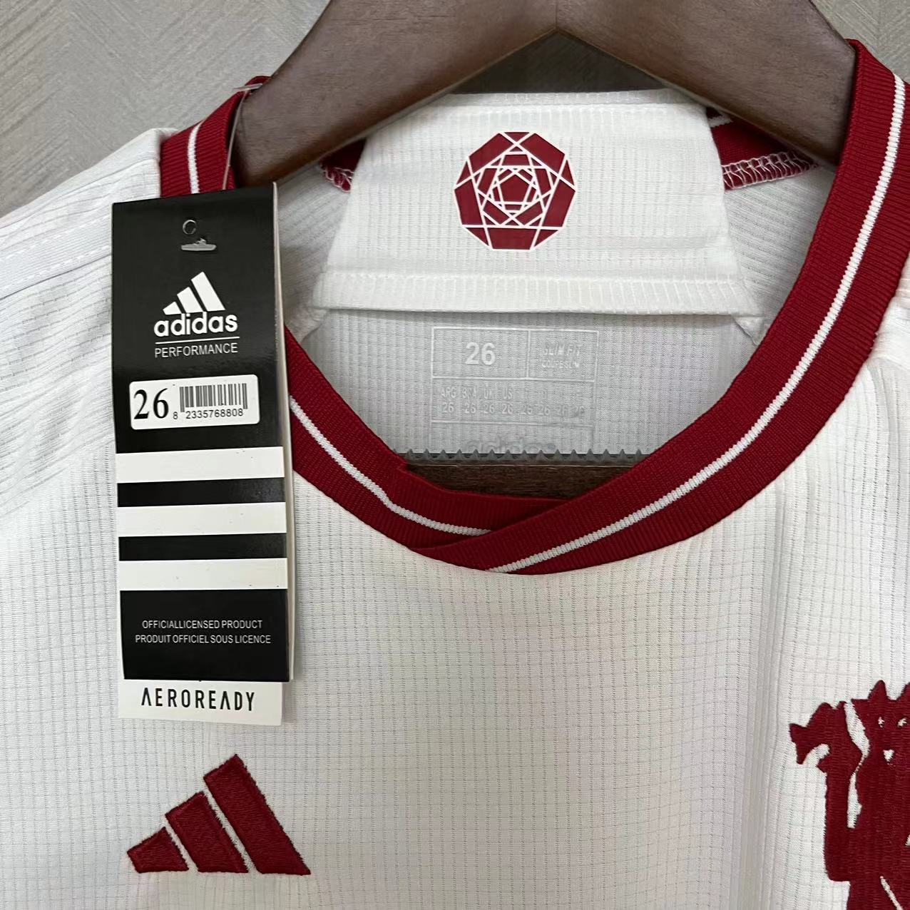KIT INFANTIL MANCHESTER UNITED THIRD 23/24